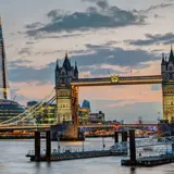 Offices and Tower Bridge in London by dusk